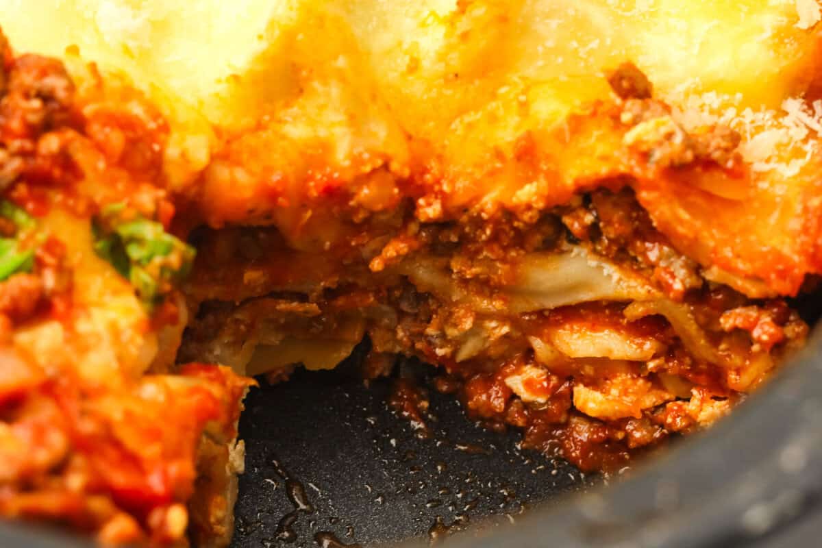 close up of layers of lasagna in the slow cooker