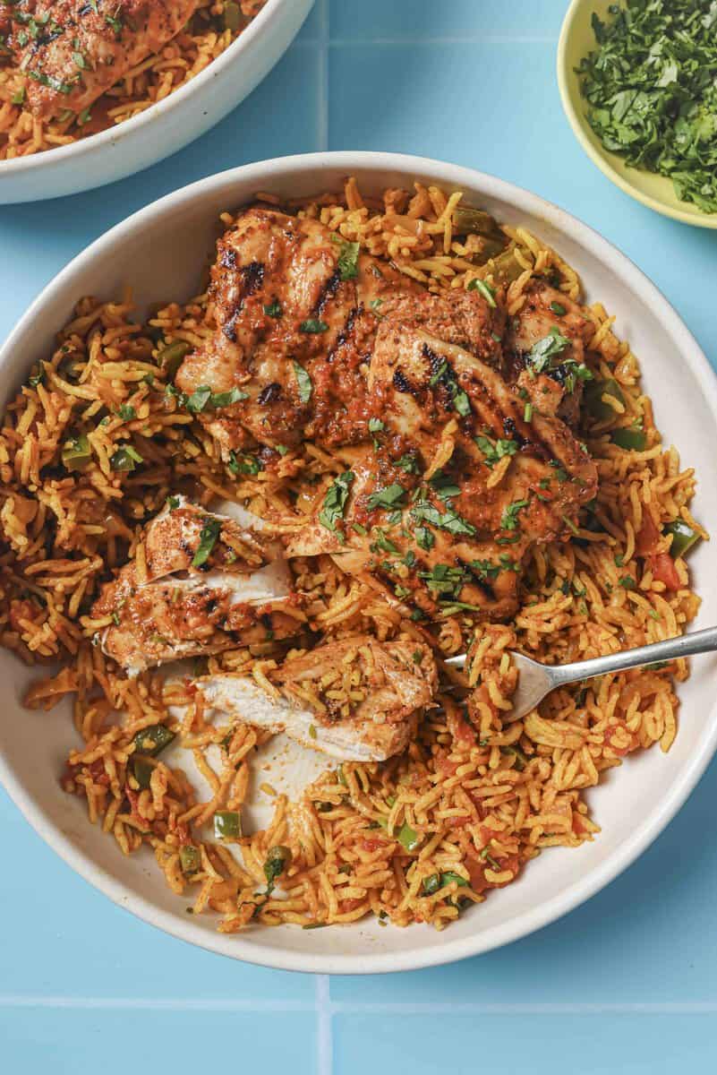 nandos chicken with a fork on a plate