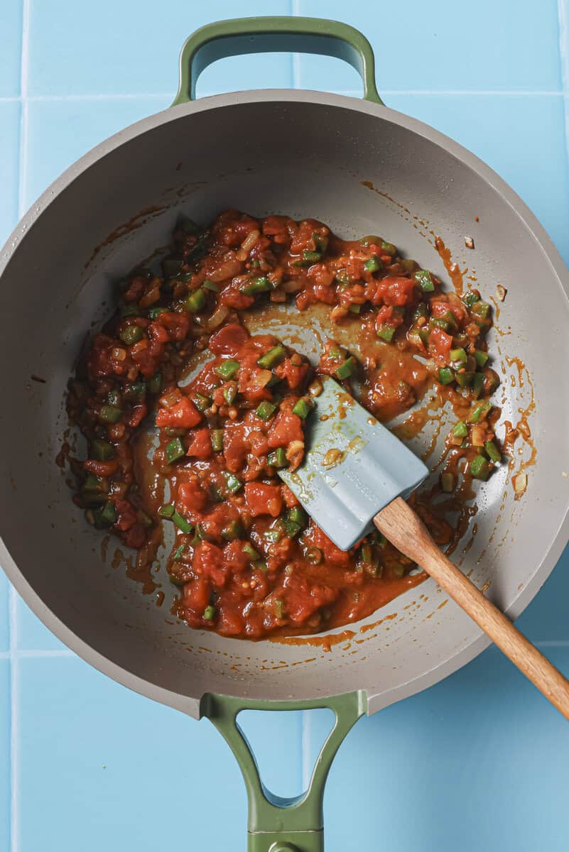 spices and vegetables sauteeing in pan