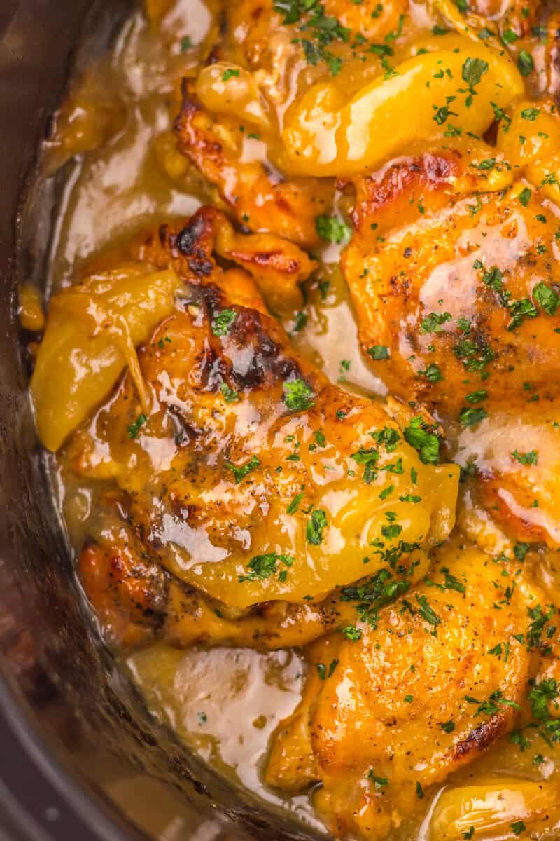 Cooked apple and chicken in a slow cooker.