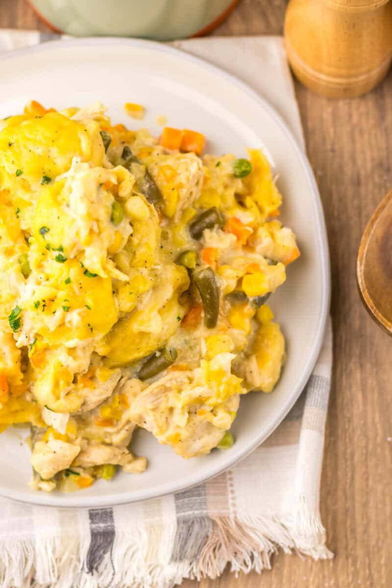 A serving of slow cooker chicken and dumplings on a white plate. 