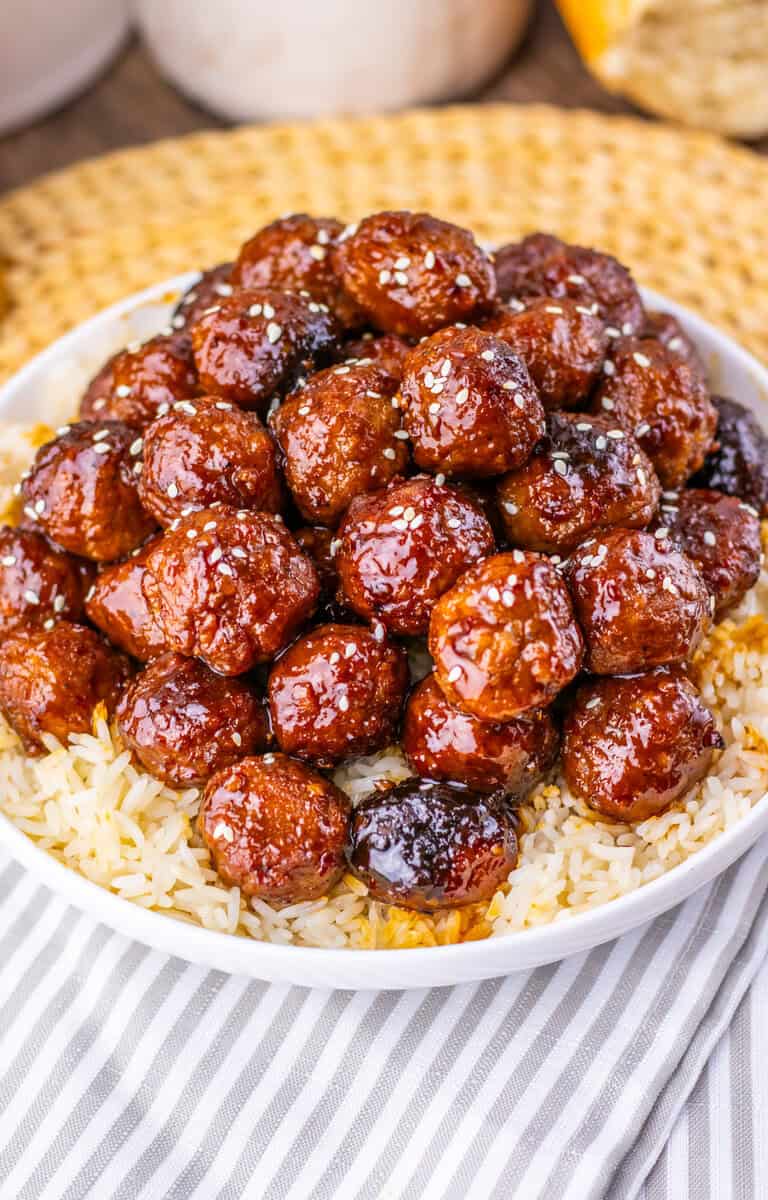 Sticky sesame meatballs over brown rice.
