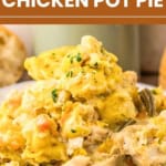 A plate of slow cooker chicken pot pie, reminiscent of classic slow cooker chicken and dumplings, features tender chunks of chicken, vegetables, and a fluffy biscuit topping, all garnished with fresh herbs.