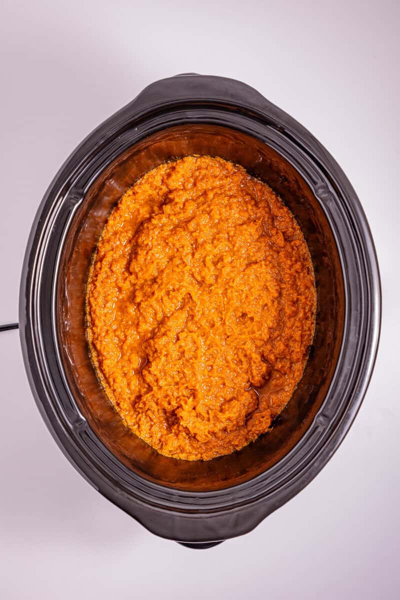 Mashed sweet potatoes in a slow cooker.